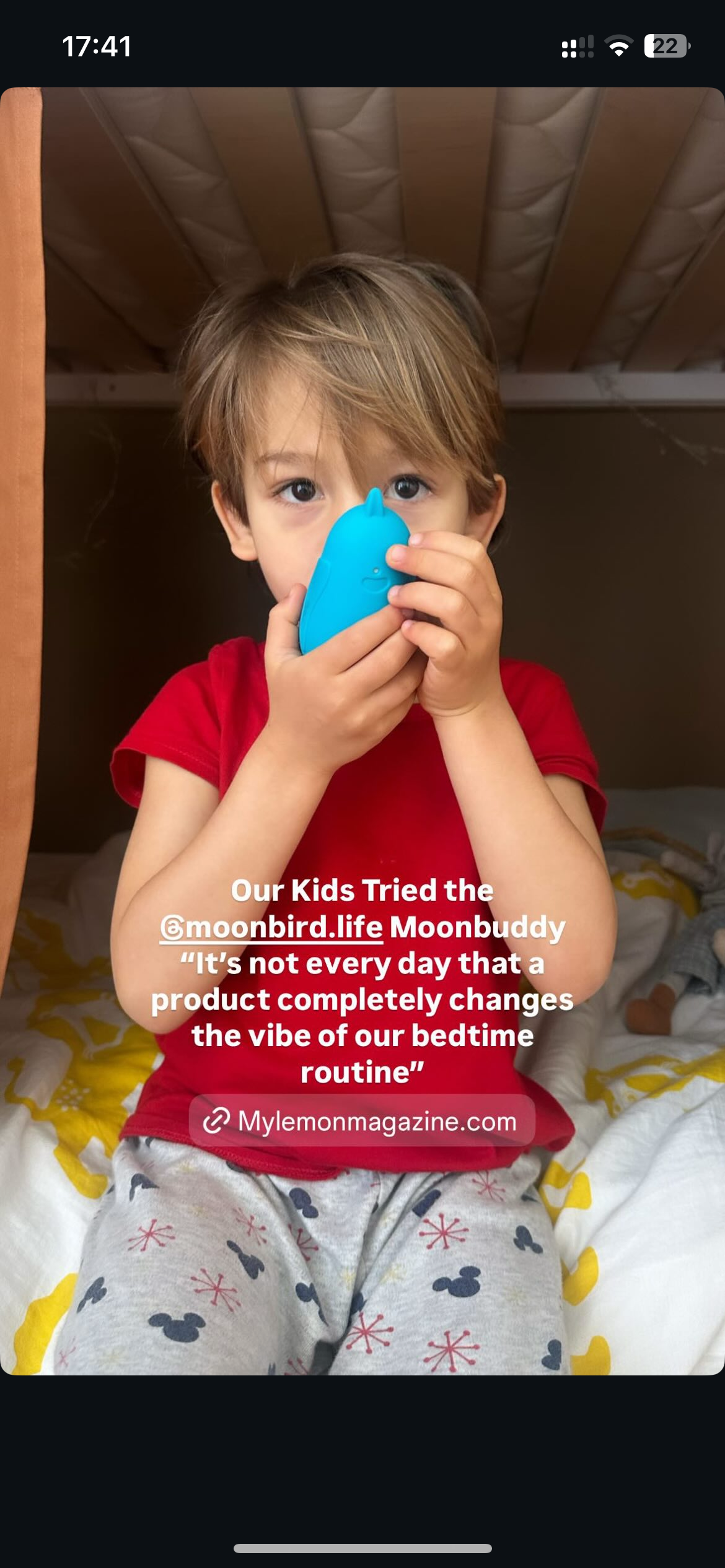 Child holding moonbuddy